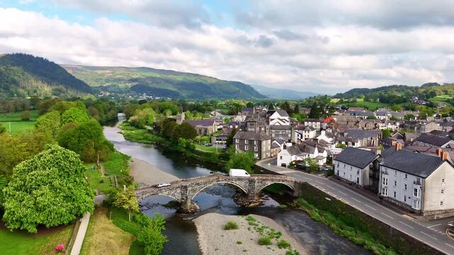 Wide Aerial Pan of Llanrwst, Pont Fawr, and the Conwy Valley, North Wales