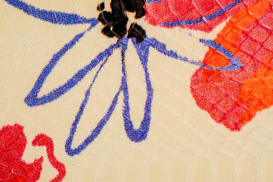 Colorful exotic leather background with painted floral pattern on python skin texture