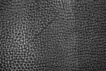 Fototapeta premium Dark black leather texture with fine grain surface and realistic material background