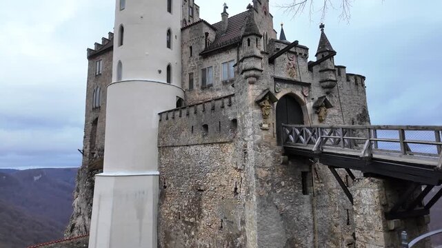 Schloss Lichtenstein Castle in Winter with Dramatic Bridge