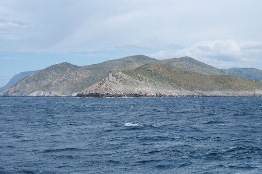 Sailing past the southern point of the Peloponnese in Greece, near to Elafonisos in a sailing Yacht and showing the watchtower.