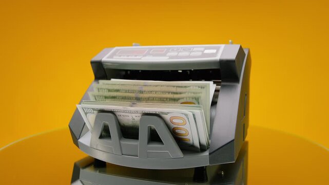 Cash counting machine processing dollar bills