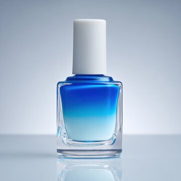 Elegant Blue Ombre Nail Polish Bottle Studio Shot.