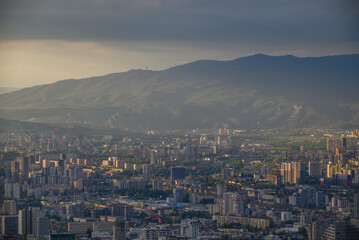 Fototapeta premium Panoramic aerial cityscape sunset view of Tbilisi, the capital of Georgia