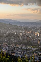 Fototapeta premium Panoramic aerial cityscape sunset view of Tbilisi, the capital of Georgia