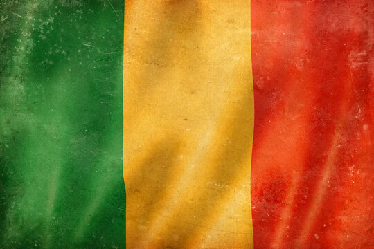 Old vintage flag of Mali, worn and stained