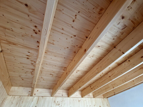 supporting beams and battens, often used for soffits or ceilings in log cabins. wood used in the picture is probably a coniferous tree, such as spruce or Siberian larch