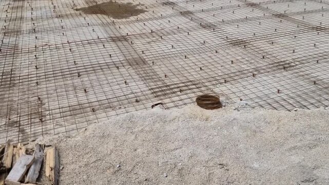 Rebar Spacers Bar Chairs: closely long, dark horizontal lines under mesh, those are likely continuous spacer. ensure steel sits at correct height. Steel must be buried deep enough within concrete 