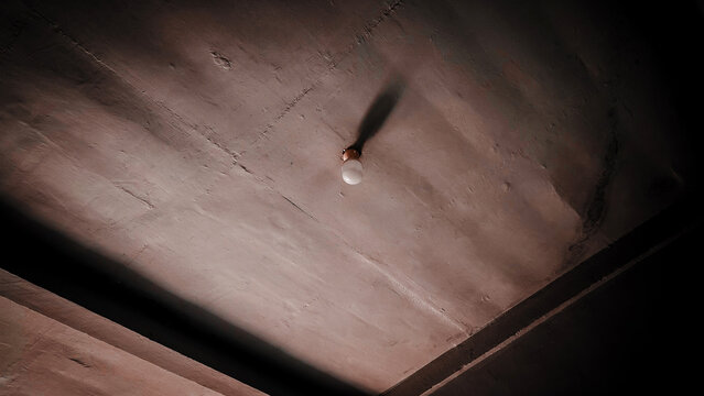 white LED light bulbs above the concrete ceiling