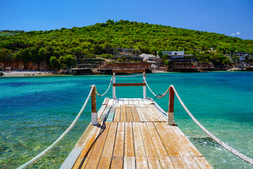 wooden pontoon on amazing beach of Ksamil , Albania , touristic destination © eric