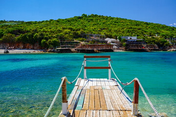 wooden pontoon on amazing beach of Ksamil , Albania , touristic destination © eric
