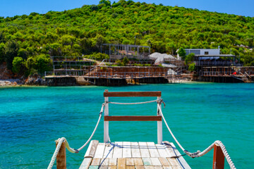 wooden pontoon on amazing beach of Ksamil , Albania , touristic destination © eric
