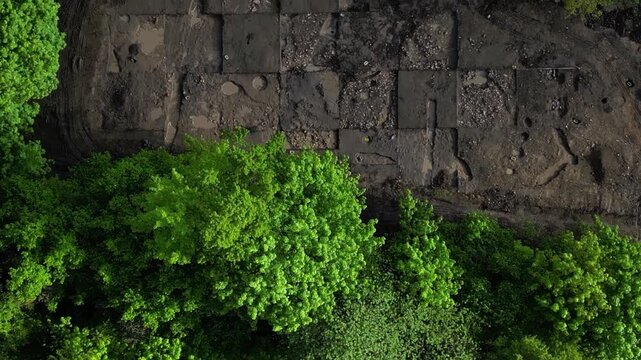 ceramic kiln stone. professional archaeological excavation in progress. sharp, clean edges and geometric patterns soil aren't accidental systematic method used to reveal history hidden beneath surface