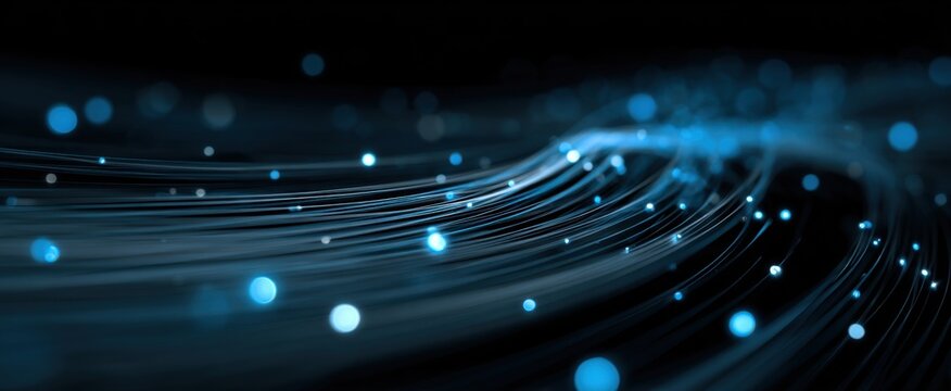 Abstract Blue Light Streaks and Bokeh Particles on Dark Background.