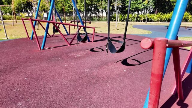 Empty Colorful Swing Set in Urban Park, S&atilde;o Paulo Brazil
