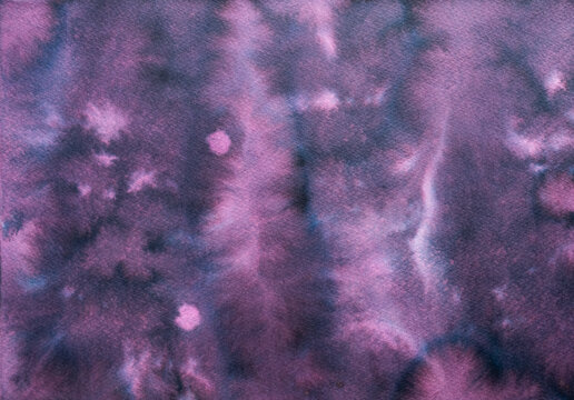 Abstract watercolor painting creating a seamless background texture with blending deep indigo and vibrant violet tones, resembling a starry night sky or a cosmic nebula