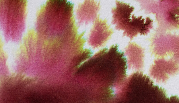 Abstract watercolor ink blending and bleeding across absorbent paper, forming organic maroon, pink and green washes with grainy texture and fluid, painterly movement