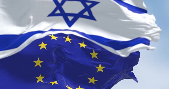 Israel national flag waving in the wind with the European Union flag. EU and Israel maintain close relations in trade and research. Seamless 3d render animation. Slow motion loop. Selective focus