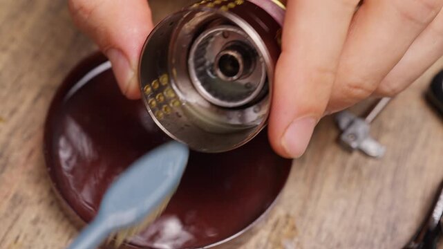 Brushing Inner Spool Housing of Fishing Reel During Alcohol Cleaning and Mechanical Maintenance Procedure, Macro Closeup Shot