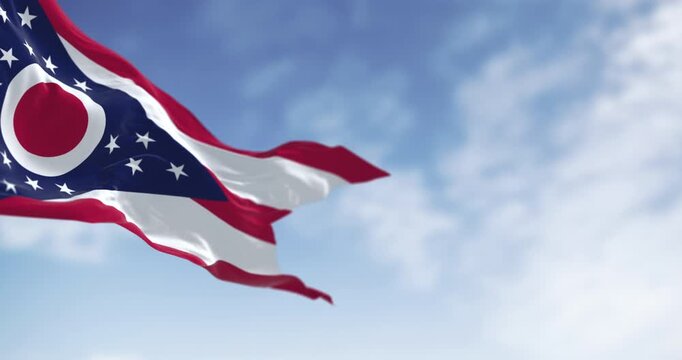 The Ohio state flag waving in the wind on a clear day. Seamless 3d render animation. Slow motion loop. Selective focus