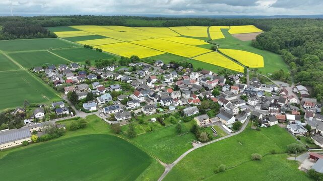 Aerial View of Ketternschwalbach near H&uuml;nstetten with Rapeseed Fields in Hesse, Germany