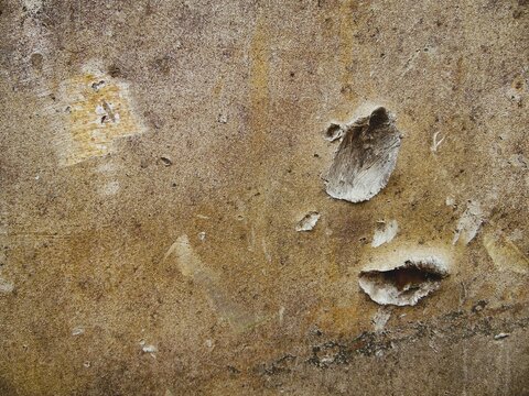 Texture of destroyed APC armor with shell hits and shrapnel holes, damaged armored vehicle hull from modern military conflict, rusty steel surface of knocked out armored personnel carrier, war destruc