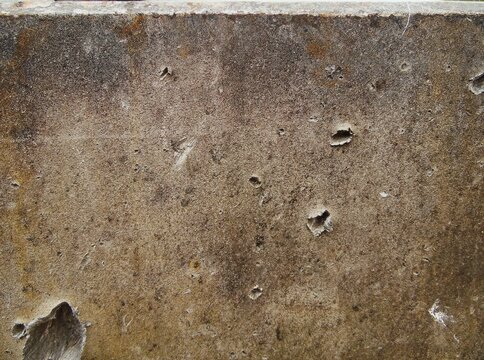 Texture of destroyed APC armor with shell hits and shrapnel holes, damaged armored vehicle hull from modern military conflict, rusty steel surface of knocked out armored personnel carrier, war destruc
