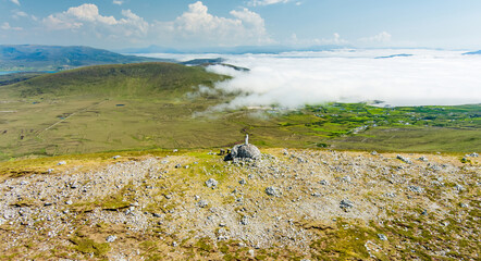 Obraz premium Statue of the Virgin Mary on Minaun Heights, Achill Island, County Mayo, Ireland. Rocky mountain summit with sweeping Atlantic views on the Wild Atlantic Way.