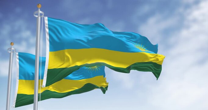 Rwanda national flags waving on a clear day. Three horizontal bands: blue, yellow, green with 24 rays yellow sun. Seamless 3d render animation. Slow motion loop. Selective focus
