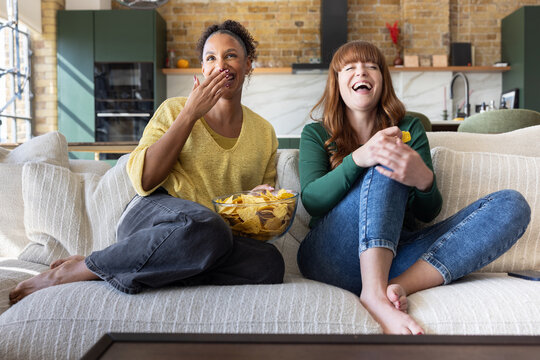 Women watching a fun movie together