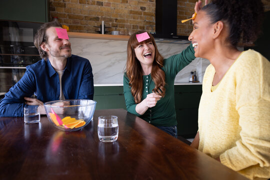 Group of friends enjoying a fun guessing game.