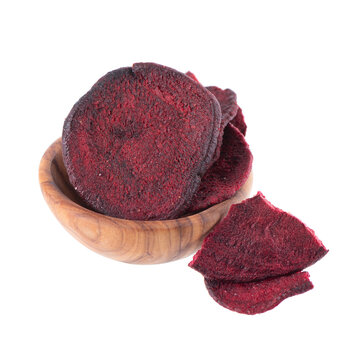 Crispy roasted beetroot chips with sea salt, isolated on white background. Healthy and crunchy natural vegetable snack. Clipping path.
