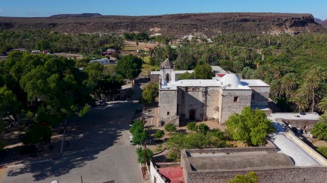 Explore aerial views of Mission Church in San Ignacio Baja California Mexico and see the oasis and nearby town from above