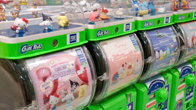 Row of Takara Tomy Arts Gacha Machine Dispensing Sanrio Characters and Pokemon Figurines in Capsule Toy Vending Shop on April 18, 2026 in Bangkok, Thailand
