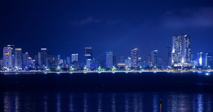 Aerial night view Nha Trang Vietnam coastal skyline at t with vibrant colors and urban beach scape