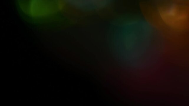 Abstract colorful light glowing and blurring on a dark background creating a unique texture or overlay, perfect for digital art, design elements, and artistic concepts