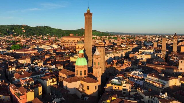 Sunset aerial view of Italian city of Bologna, Tuscany, Bologna towers Torre deli Asinelli and Torre Garisenda, drone shot of Bologna old town, travel in Italy