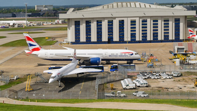 London, England, UK - 18 April 2026: British Airways maintenance hangar at Heathrow airport. In the foreground is one of the airline's Boeing 787 aircraft (G-ZBKG) and  Concorde jet (G-BOAB)