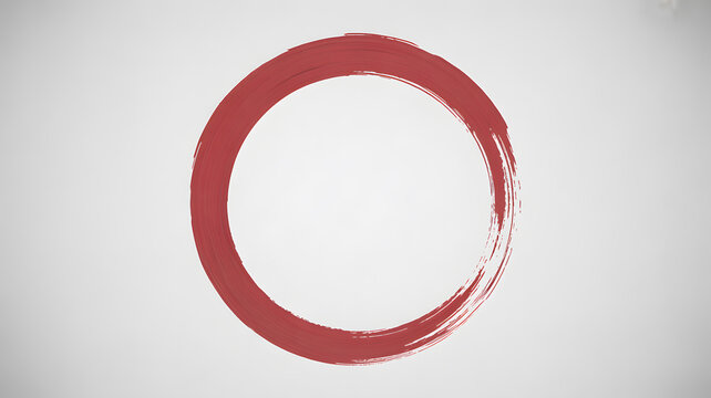 Red brushstroke circle forms an enso symbol on a simple white background, embodying minimalism and meditation
