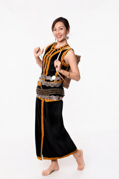 Beautiful young kadazandusun native female in her traditional costume in isolated background