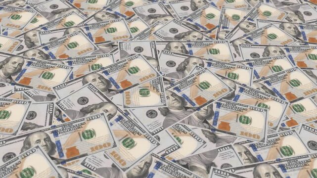 Full frame of hundred dollar bills scattered on a table, camera panning over neatly organized cash money stack. US currency banknotes backdrop for financial, banking, wealth and business concepts.