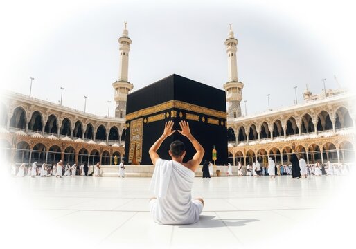 Muslim man praying in front of the kaaba in mecca during hajj pilgrimage