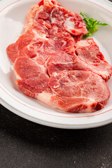 Fototapeta premium Raw pork steak pork tenderloin, food preparation lunch or dinner tasty organic snack fresh farm product delicious gourmet food background on the table rustic food, top view copy space