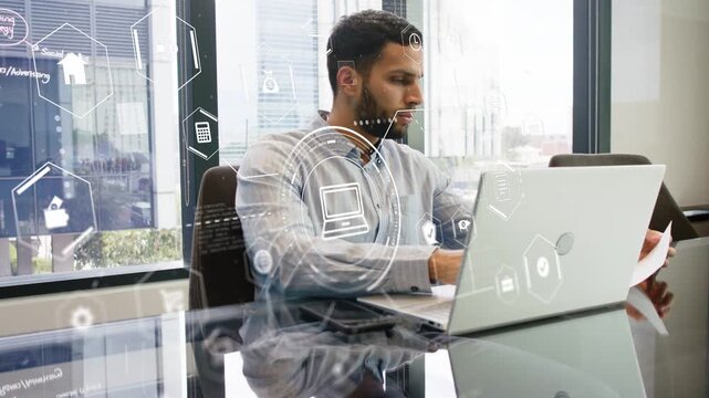Man reading doc typing laptop on glass table HUD moving glancing up confirming business info