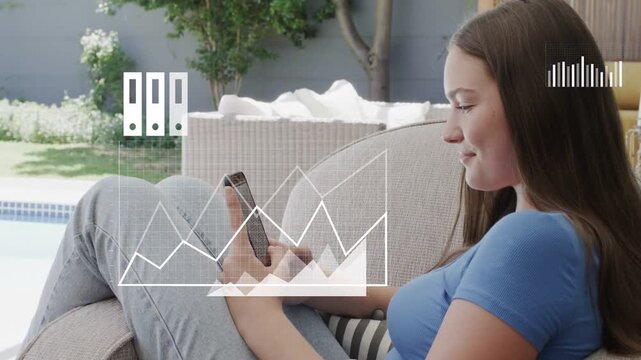 Female teen tapping phone on lounge chair by pool, calling tech overlays expanding into data charts