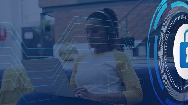 Woman typing on laptop in office, security HUD sliding from right, circuit lines protecting data