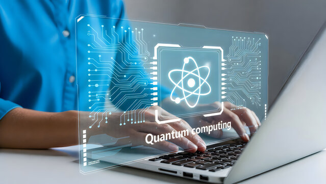Person working on laptop with quantum computing interface