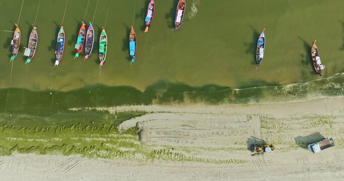  Aerial Shot of Tractor Cleaning Algae on Patong Beach
Green Algae Bloom Along Sandy Shore of Patong Beach
Aerial Scene of Beach Restoration Work in Patong
moss on Patong Beach.