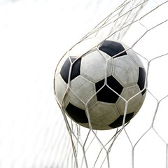 Fototapeta premium A classic soccer ball hits the back of the net, capturing the high-energy moment of a winning goal and victory.