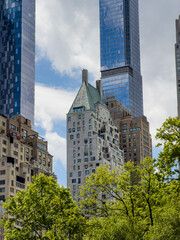 Obraz premium Hampshire House and Central Park Tower in New York City. Close up view of historic Hampshire House green roof and modern Central Park Tower skyscraper, Manhattan, USA.